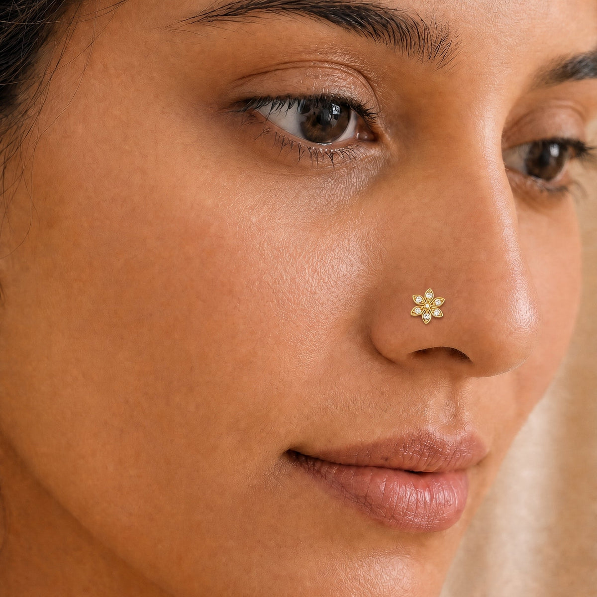 Woman wearing the Saiji Diamond Floral Nosepin, a yellow gold floral nose pin with natural diamonds