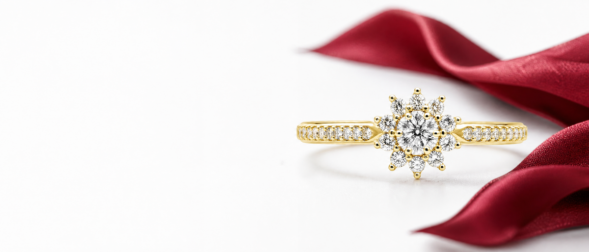 Saiji Diamond hero banner - starburst diamond ring on white background with ruby silk accent